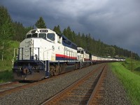 Tucked away in Macalister siding waiting for a south bound train 570 to arrive. A rather threatening sky in the background and some dramatic lighting for this image. shortly after there quite a downpour of rain. After train 570 arrives we will depart the siding with another 38 mile run to Quesnel, ending our 315 mile journey on this day from Whistler. My work day began at 0600 at Whistler, image time was 18:38 and I'll be on duty for another couple of hours. Long day but the scenery is spectacular making the day worthwhile.