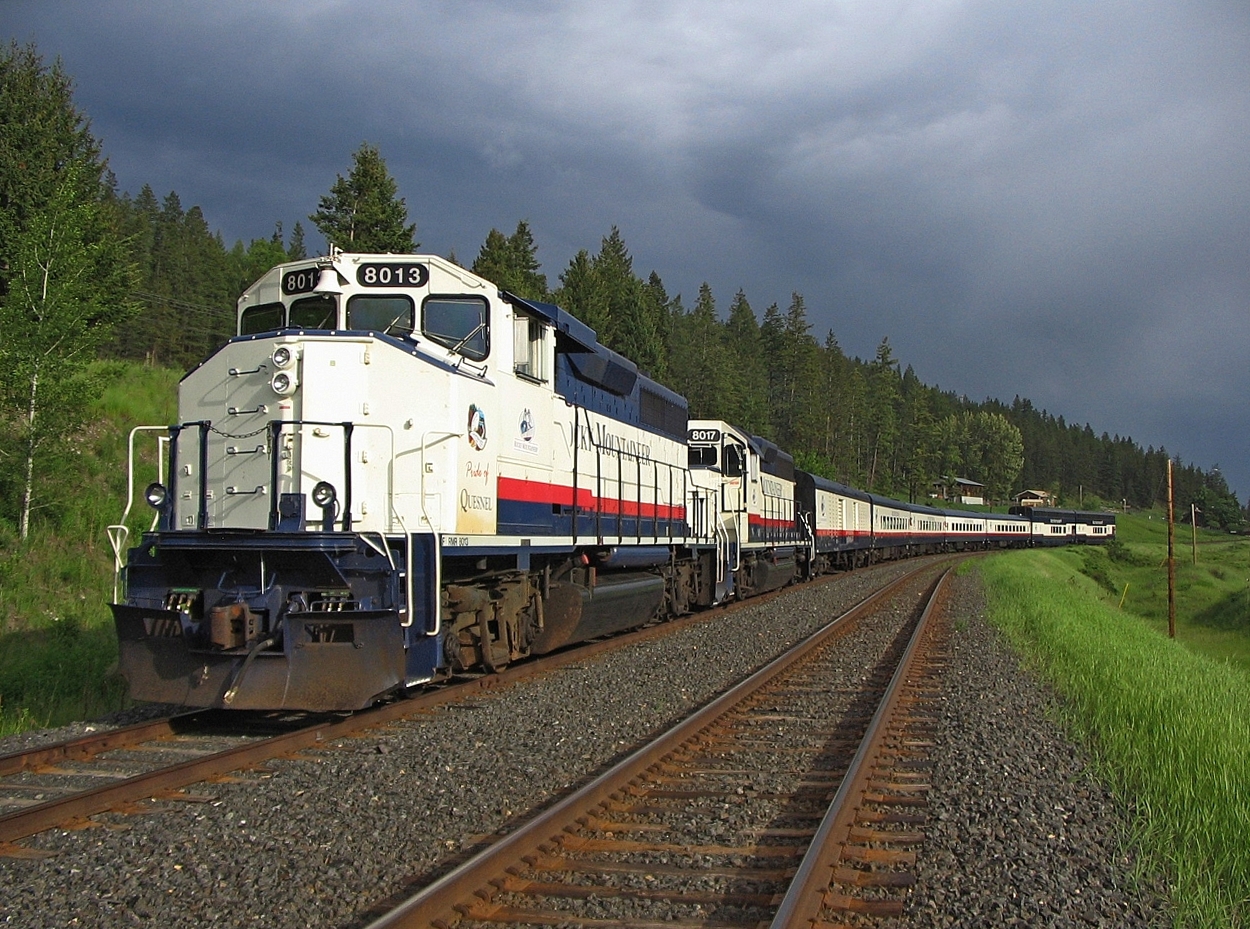 Tucked away in Macalister siding waiting for a south bound train 570 to arrive. A rather threatening sky in the background and some dramatic lighting for this image. shortly after there quite a downpour of rain. After train 570 arrives we will depart the siding with another 38 mile run to Quesnel, ending our 315 mile journey on this day from Whistler. My work day began at 0600 at Whistler, image time was 18:38 and I'll be on duty for another couple of hours. Long day but the scenery is spectacular making the day worthwhile.