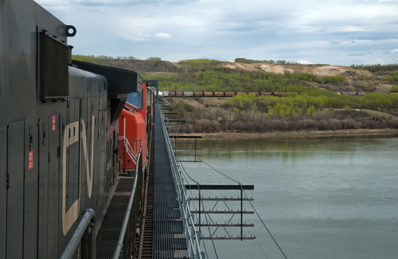 Looking railway east as we cross the North Saskatchewan River just west of North Battleford with train A411. The location I took http://www.railpictures.ca/?attachment_id=33984 from is visible just above the 8th covered hopper back. I don't remember why 411 was so early/late on this day but something must have happened, usually it would be called some time between 2200 and 0200.