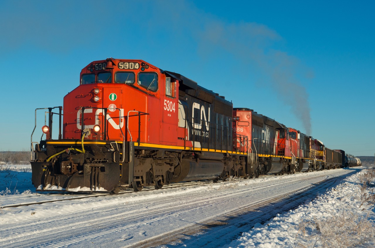 CN 478 is just about ready to leave Fort Nelson BC on a cold but clear November morning, bound for Fort St John BC. Fort Nelson is the most northerly station on the former BC Rail portion of CN sitting at mile 978.8 (978.8 miles north of North Vancouver). I recommend expanding the map below just to get a sense of how far north it really is. The main commodity being transported in this photo and in more recent years is refined fuels (diesel, gasoline, etc) to be offloaded in Fort Nelson and trucked to communities further north. Frac sand and and steel pipe have been on again/ off again revenues in recent years as well. The head end three sulphur cars are the only loads on this 478. In late 2017 the industry producing the sulphur pellets ceased such operations in Fort Nelson.