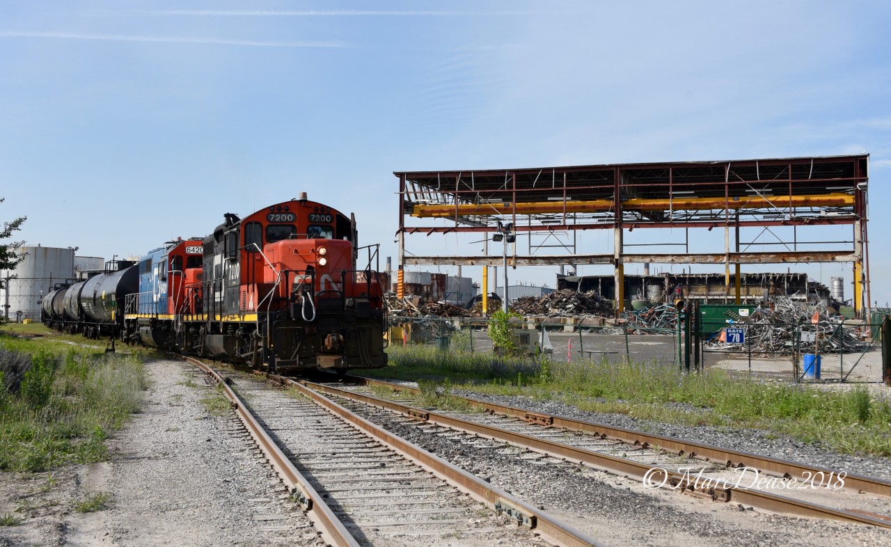 CN 7200 with GT 6420 work the IOX job, meanwhile demolition of the ESSO Lube plant is going fast and furious.