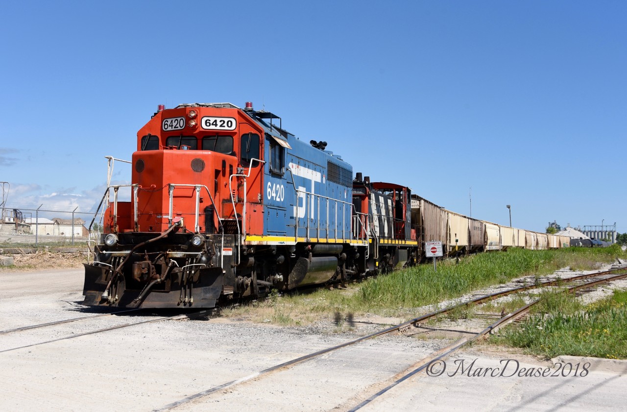 Working the IOX job today in Sarnia were GT 6420 and CN 1412. After switching at Imperial Oil they made their way down to the grain elevator to retrieve 10 hoppers.