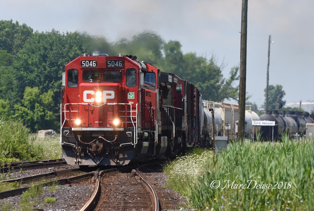 A rare CP leader on train 504 into Sarnia from Port Huron MI. CP 5046 with CN 2201 and CN 2099 roll past Hobson.