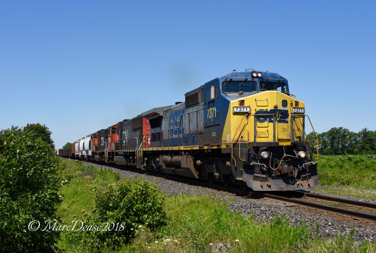 GECX 7371 leading train 509 with CN 5613 and CN 5730 trailing east bound at Camlachie Sideroad.