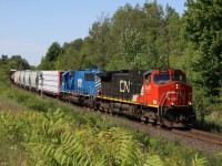 CN train 383 has CITX SD60 6017, formerly a SOO Line unit, trailing. A healthy dose of spring rain has covered the area with thick greenery gradually making some clear shots here a mile 30 a lot more challenging. I’m going to miss the rainbow of leasers on CN once new power arrives. 