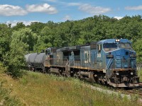 IC 2456 and IC 2455, both retaining their LMS/Conrail blue paint, power train 435 through the north end of Burlington.