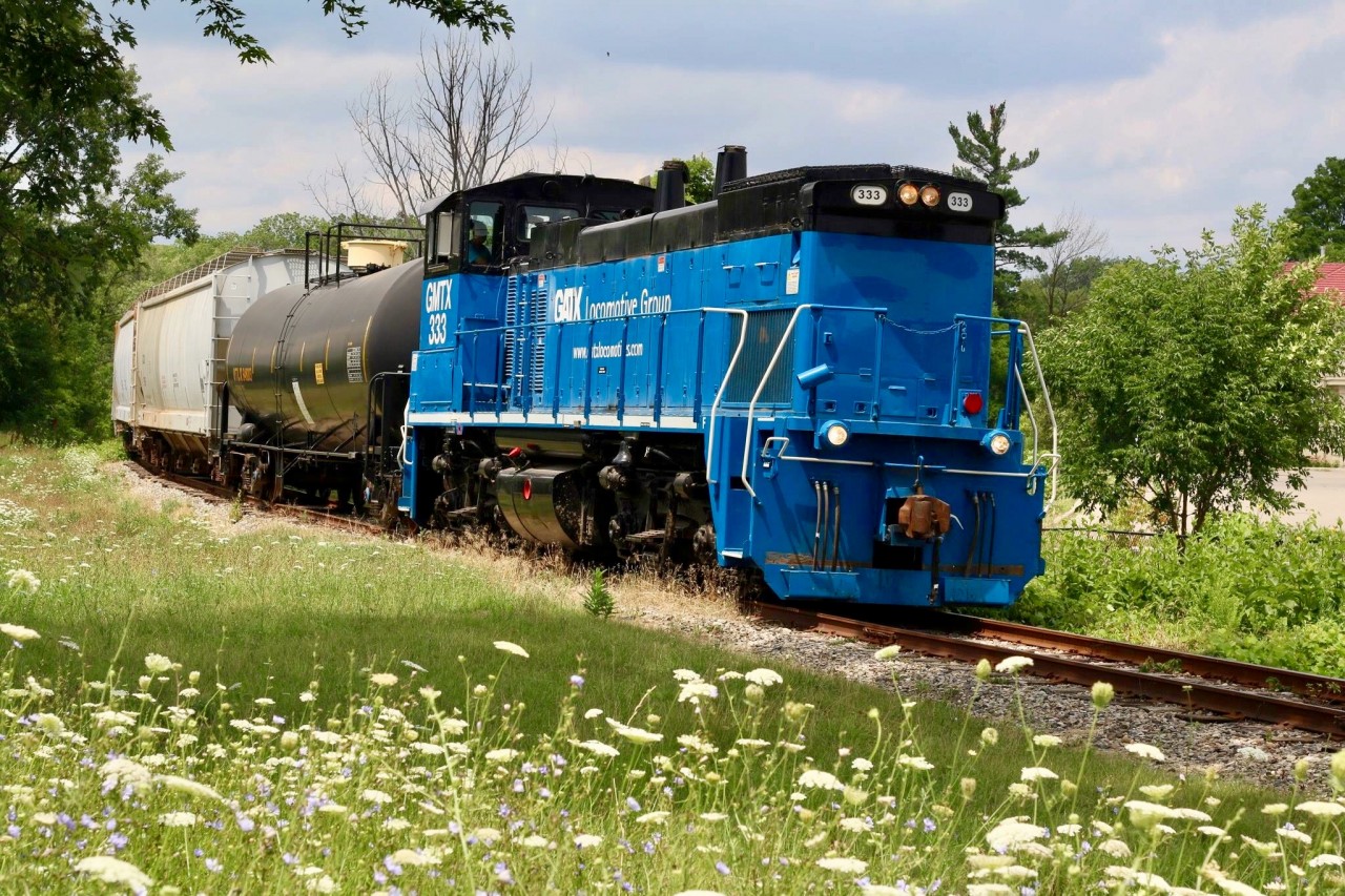 It nice that there is still some greenery left between Streetsville and Brampton. Today was the first day I actually got to briefly chase the new revamped OBRY. I’ve never been a big fan of End cab switchers, ok I do love RS23s and even SW1200s :) but I’ll take a road switcher any day over an end cab. I do like the blue on the GATX units but hope one day OBRY will once again sport a unit in company paint, along with tourist train service. Only time will tell I guess. I’ve shot the curve here before and with lots of slow orders today it was easy to follow them as they are seen about to cross Steele’s Avenue heading southbound at 1pm. It was nice seeing a very friendly crew in the cab too making my boys day :)