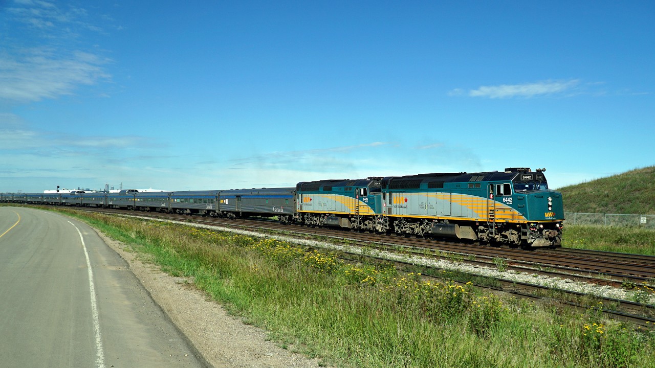 A late running VIA #2 hauled by 6442 and 6449 heads east through Clover Bar.