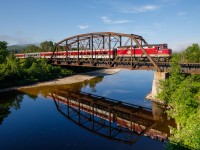 The northbound Agawa Canyon tour train is seen rollin’ through Searchmont along “The Tracks of The Black Bear”. Having performed my song about the ACR at a music festival in Sault Ste. Marie the previous night, it sure felt good to get back!