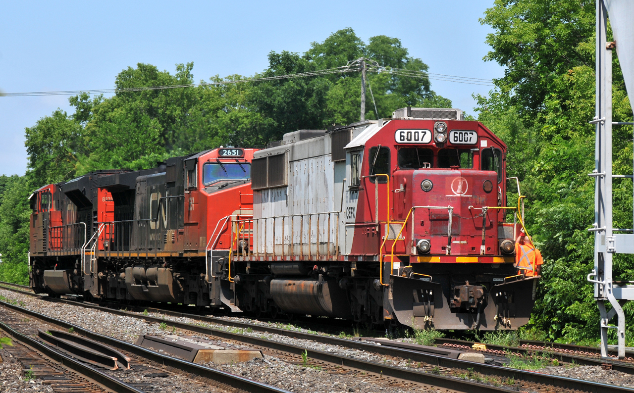 M38531 01's power (CN 8838, CN 2651, CEFX 6007) headed back to their train after finishing up a set-off at Brantford.

CEFX 6007 is still sporting mostly original SOO colors, along with Indiana Railroad nose markings from its time on INRD in the mid 2000's