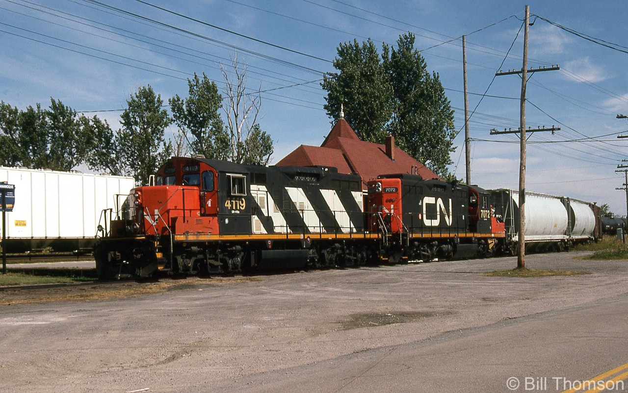 A CN local with GP9RM's 4119 & 7072 as power switches the siding at Gananoque (formerly used by the Thousand Islands Railway) by the VIA station that is located a ways from the actual town, at Mile 153.9 along the CN Kingston Subdivision.