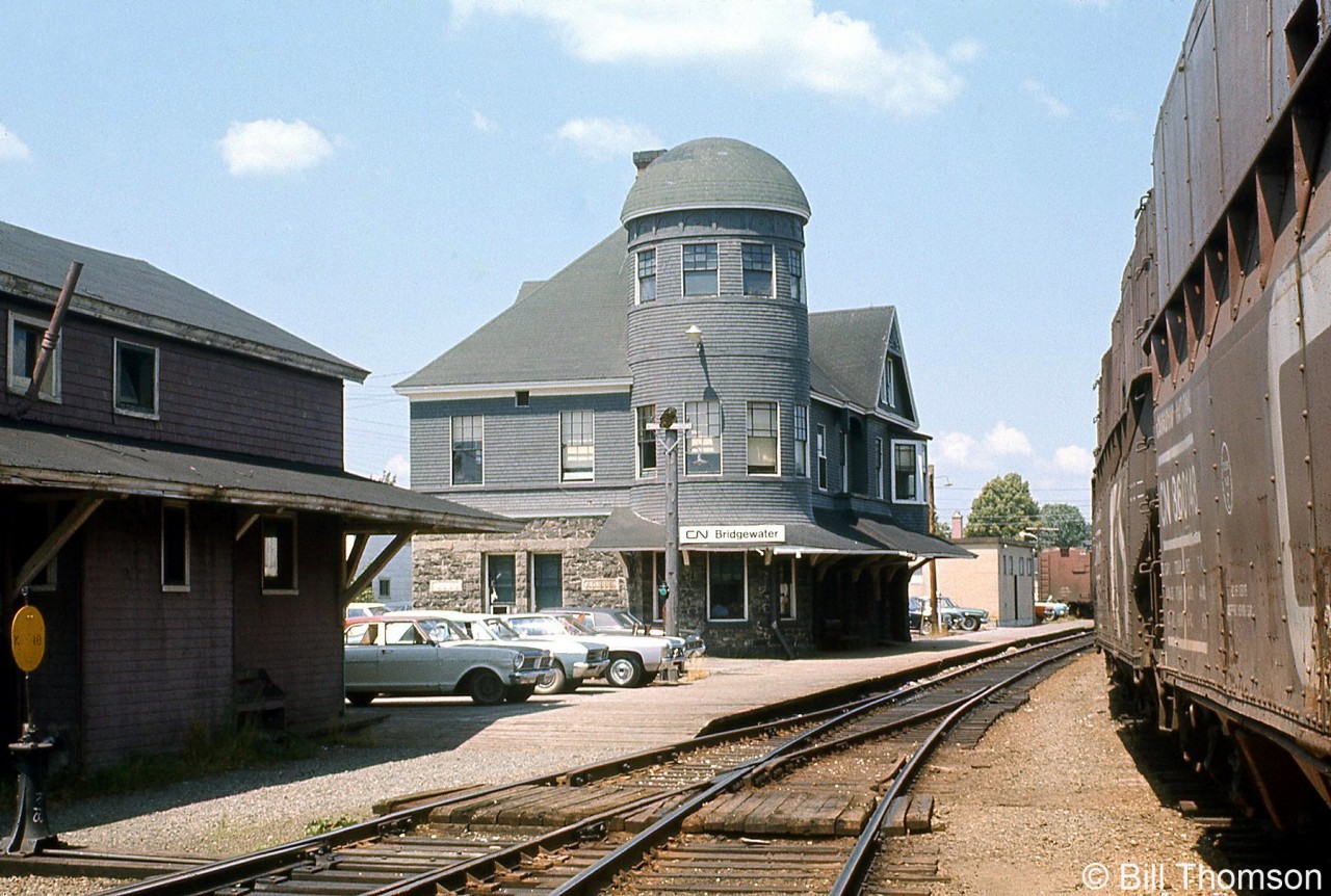 The CN Bridgewater NS station is pictured in July 1971. It was built for the Halifax & Southwestern around 1901, and CN eventually took over the line. Unfortunately, it was destroyed by fire in 1982. On the track to the right of the scene are some CN hopper cars with extended sides (often found in woodchip service).

Note: Geotagged location not exact.