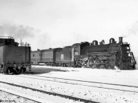 CN Pacific 5611 (K3d class, built by Baldwin for the GTR in 1910) powers train #36, about to leave Goderich bound for Stratford on a snow-covered day in March 1958. The tender of CN S2a Mikado 3547 is visible on the left.