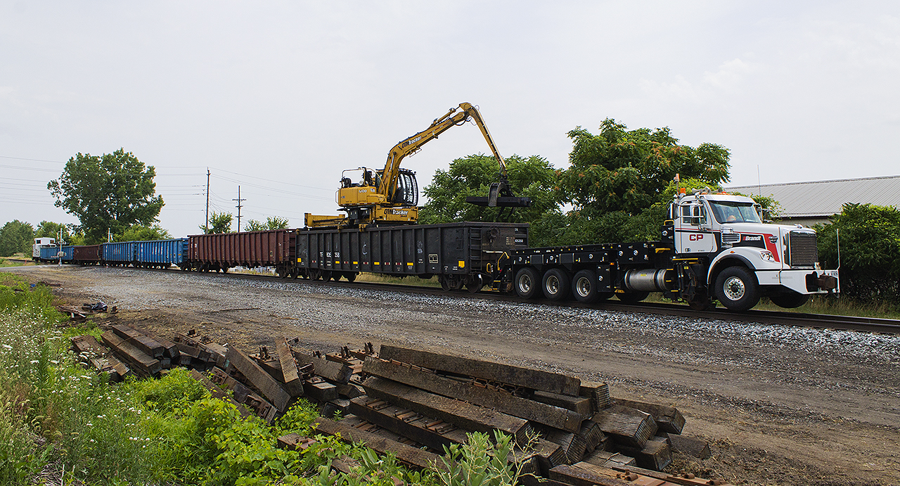 ALMOST A TRAIN!  With one of CP's newer hi-railers leading the charge, 6-7 gondolas in tow along with a van - the MOW crew continues to change the railway landscape in Chatham.