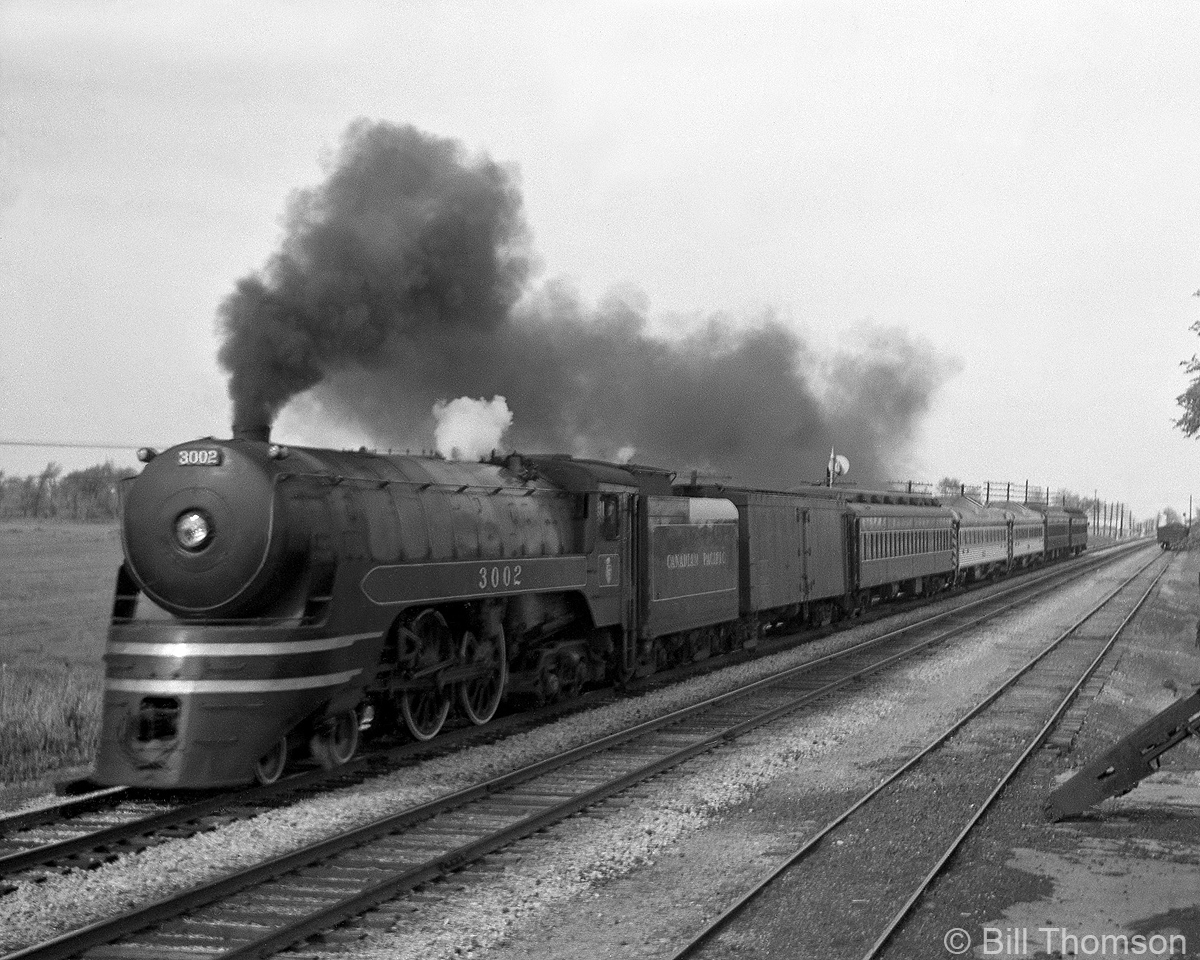 Canadian Pacific train #629 was a late afternoon passenger train out of Toronto (for Windsor & Detroit) on the Galt Sub. During the week Budd RDC's were used (known by CP as "Dayliners"), but on Fridays increased traffic required extra coaches and a locomotive to be added. This Friday on one Spring 1954 day, F2a-class 4-4-4 "Jubilee" 3002 is the power, leading #629 through Erindale with the normally assigned RDC's mixed in with the added passenger cars.