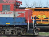 Ex-CN 4004 then Ex-Rail America 4095, now Goderich-Exeter 4095 stands in the foreground to GERX 3393 on a sunny spring afternoon at Goderich station. A work crew was operating a crane that was moving axles that day. 
Crew seemed to enjoy the sight of a jeune-femme in a short denim dress taking pics of the goings-on.