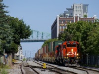  The Pointe St-Charles Switcher is getting ready to leave the Port of Montreal with GP38-2 CN 4707 & GP9 CN 7054 for power and a train consisting almost entirely of intermodal traffic.
