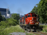 A transfer is leaving the Port of Montreal, with GP9's CN 7054 & CN 4115 in charge of forty-six cars.
