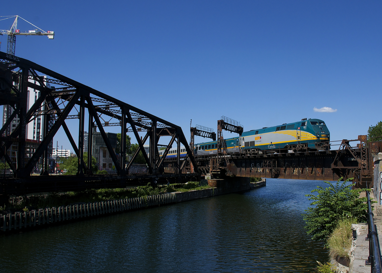 After having come in as VIA 62 and then wyeing on the nearby Victoria Bridge, a consist made up of VIA 917 and LRC cars is backing up to Central Station in Montreal to become VIA 69.