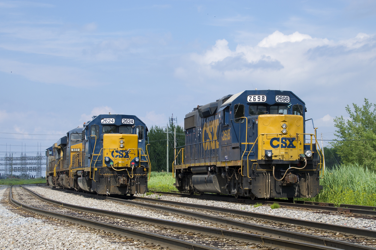 With CSX announcing that it has puts its line from Syracuse, NY to Beauharnois, Qc for sale, CSX's operations in Quebec seem to be living on borrowed time. Here two GP38-2's and two GE's are parked at the relatively busy terminal of Beauharnois with CSXT 2624 ahead of CSXT 833 & CSXT 149 at left and CSXT 2698 at right.