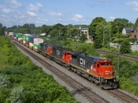 Standard cabs CN 2109 & CN 5470 (along with widecab CN 2668) lead a 510-axle CN 106 as it approaches MP 14 of CN's Kingston Sub.
