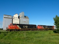 CN 806 passes a small group of elevators at Landis on the Wainright Sub west of Biggar. 