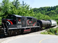 Cando Rail Services makes its final trip up the 32 mile OBRY short line to Orangeville, passing through Forks of the Credit conservation area and greeting rail fans with a warm wave. CCGX 4015 seen for the last time servicing this line, after 18 years, an era comes to an end.