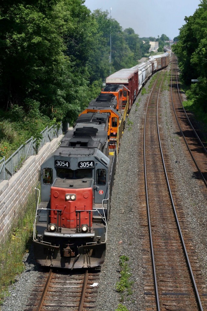 “Canada’s Tunnel Motor”  What is it with certain locomotive types that seem to get so much attention over others, we all have our favourites. The “Tunnel Motor” design was unique to the Southern Pacific and sister road Cotton Belt. It allowed the unit to pull cooler air from the bottom of the many tunnels along the SP route greatly reducing overheating of the units. The design was also applied to SD40 models. The design serves no purpose on the Goderich Exeter other then the high horsepower that comes with the SD45 variant, but is a one of a kind unit in Canada giving it a big following by Railfans. The unique unit along with a GEXR and SOR SD40 are at full throttle as they charge towards the Niagara Escarpment while departing Silver and heading into the Guelph sub. I will truly miss these sights and sounds this fall as CN takes back GEXR ‘s operations over the Guelph Subdivision.