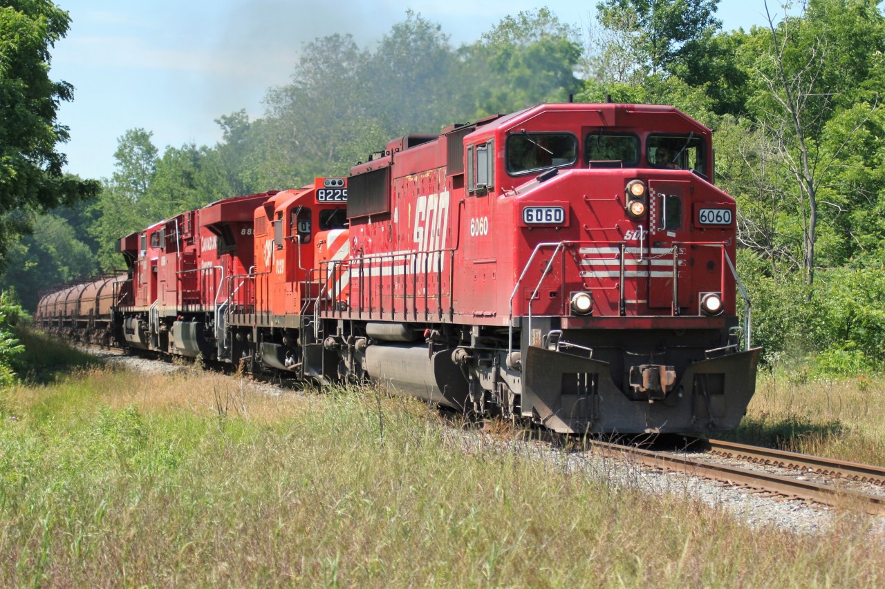 A southbound CP train is seen having just gone through Guelph Junction, Ontario has it continues its journey down the Hamilton Subdivision towards Hamilton and Welland on July 5, 2008. Powering the train are SOO Line SD60M 6060, GP9u 8229 and ES44AC’s 8896 and 8893.
