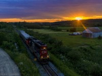 With the day's last bit of daylight left, CN 5409 leads train O998, the CN Test Train approaching Sussex, New Brunswick, running long hood forward. 
