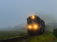 With a deathstar on the point, CN Q120 rounds the foggy S-Curve at Upper Dorchester, New Brunswick. 