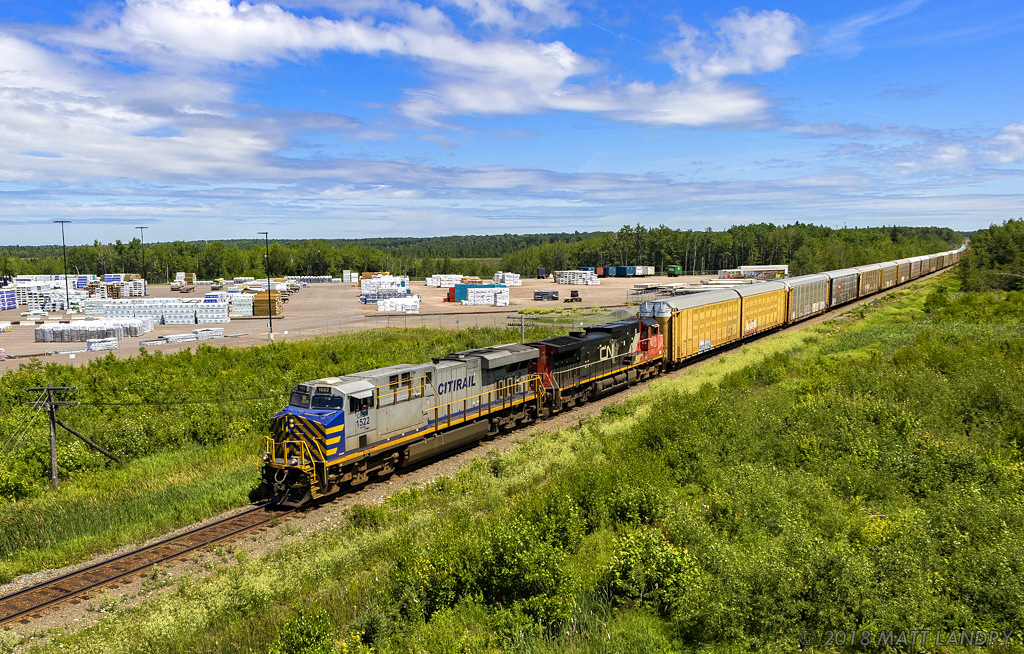 CREX 1522 leads a 2500 foot, hotshot, train A407, as they approach downtown Moncton, New Brunswick.