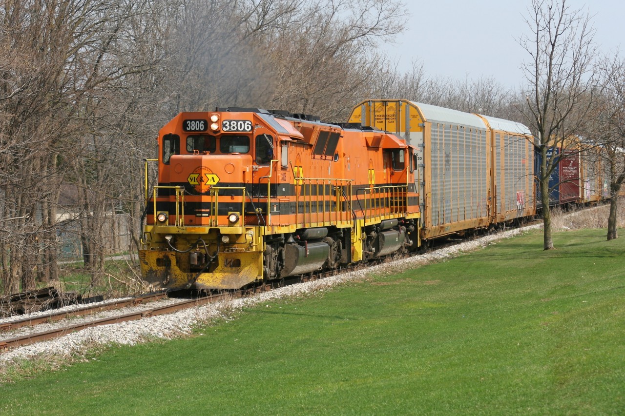 A Goderich-Exeter Railway (GEXR) train powered by STL&A GP40-3 3806 and STL&A RM-1 806 is seen approaching Queen Street in Kitchener on the Huron Park Spur. The train is returning to the Kitchener yard with several cars lifted from the interchange with Canadian Pacific.