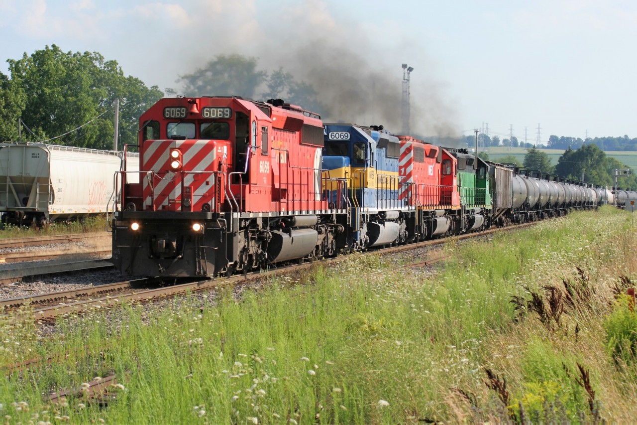 An eastbound Canadian Pacific (CP) ethanol train is seen making its way through the CP yard in Woodstock, Ontario with a consist that includes; CP SD40-2 6069, DME SD40-3 6069 and two leaser SD40-2's.