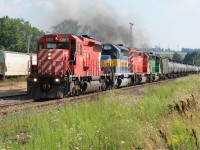 An eastbound Canadian Pacific (CP) ethanol train is seen making its way through the CP yard in Woodstock, Ontario with a consist that includes; CP SD40-2 6069, DME SD40-3 6069 and two leaser SD40-2's. 