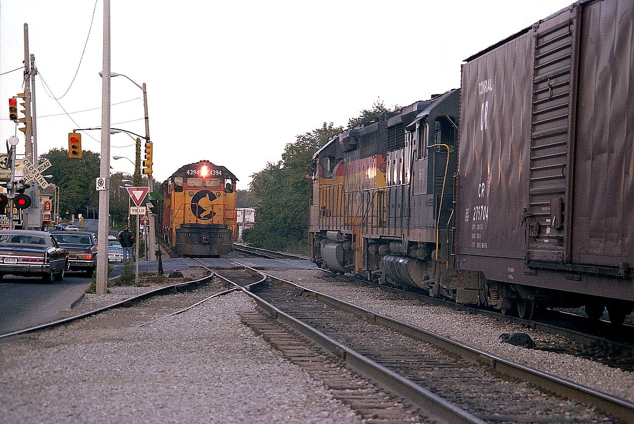 While fighting tourist traffic and hoping a train will roll thru Clifton Hill tourist area before the sun goes down was a real challenge. This particular night, even though I had to go with a shutter setting less than favourable due to night-time settling in; it was quite the High Time in the Town to catch a rare meet on Clifton Hill. Perfectly executed. After all, there is nowhere to 'sit and wait' and here we see C&O 4394 and 4404 westbound and C&O 4128 and 3562 about to converge on Clifton Hill and cause another massive snarl with their 10 MPH speed limit as they pass. In my opinion, a shot for the ages..........
Last CSX ran thru here in 1996, the last CP (or anything else) in 2001 and the line was pulled up shortly thereafter. The City of Niagara Falls had finally rid itself of an ongoing pain in the butt; and better,with land freed up, the Casino finally got to be built. Now very little remains to suggest there was once a railroad line thru here.