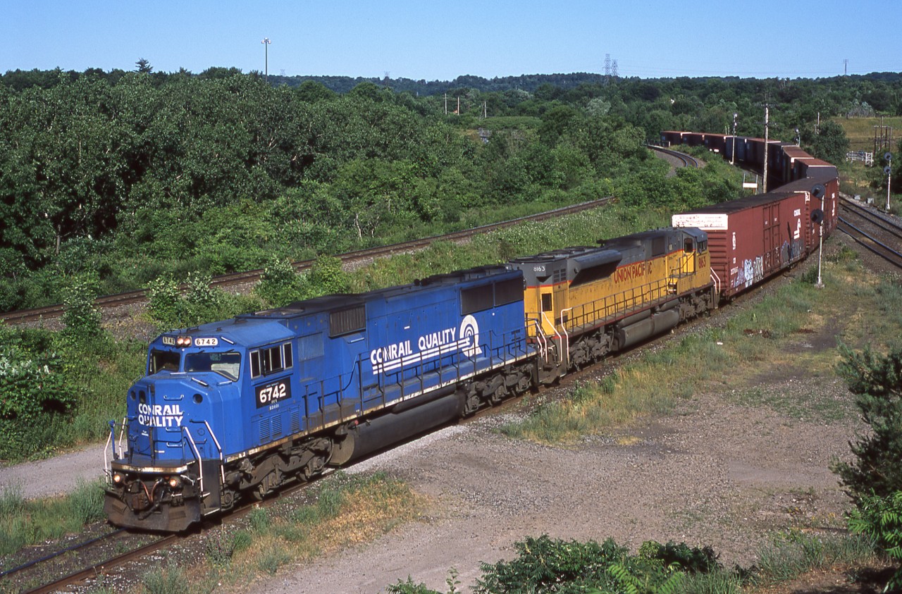 NS 328 takes the cowpath in some tasty morning light with NS/PRR 6742 and UP 8163.