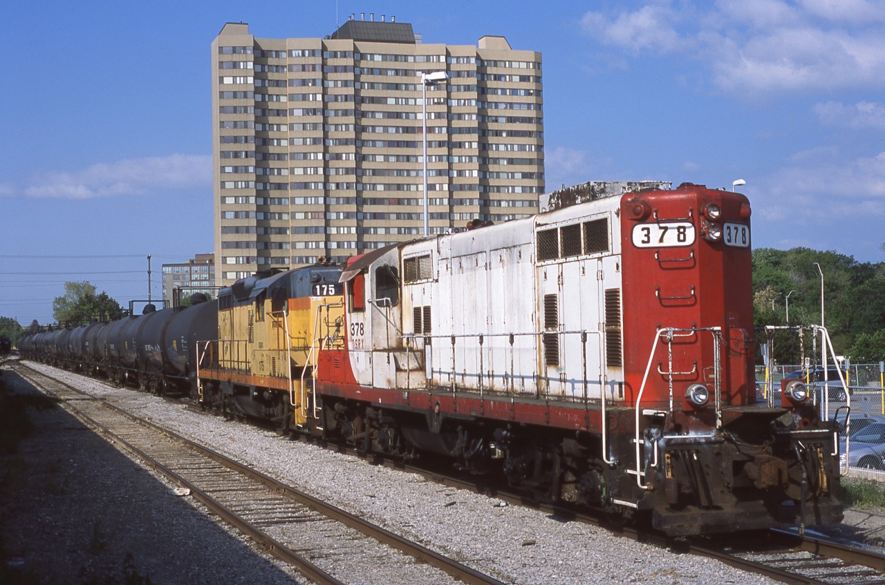OSRX 378 and 175 are seen switching the small yard next to Clarkson GO station alongside CN's Oakville Sub.