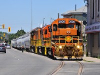 598 trudging their way through downtown Brantford with QGRY 2500, RLHH 2111, RLHH 3049, and 10 hoppers