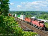 When CP 142 was added on the Hamilton sub it was a gift from the gods.  Not only was junk power assigned, which now needed pushers to get up the hill, it often ran in Daylight in the mornning due to delays. Here is the head end of the train as they rolled by Desjardins. We'd crawl back up the hill to get to York Rd for a photo of the pushers curving up the hill. Since the pushers had 1st and 2nd generation EMD, the drama was amazing. <a href=http://www.railpictures.ca/?attachment_id=15354 target=_blank>Here's a shot of  a different train with the pushers getting a workout! </a>. The GE's quickly invaded as did the ECO's.. about a year later it wasn't as good as this!

