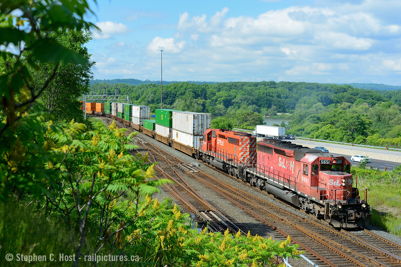 When CP 142 was added on the Hamilton sub it was a gift from the gods.  Not only was junk power assigned, which now needed pushers to get up the hill, it often ran in Daylight in the mornning due to delays. Here is the head end of the train as they rolled by Desjardins. We'd crawl back up the hill to get to York Rd for a photo of the pushers curving up the hill. Since the pushers had 1st and 2nd generation EMD, the drama was amazing. Here's a shot of  a different train with the pushers getting a workout! . The GE's quickly invaded as did the ECO's.. about a year later it wasn't as good as this!
