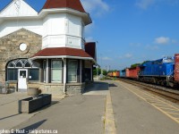 Georgetown was one of my favourite towns as a child, and I have family history here. Not surprising  my favourite childhood towns involved some form of railways: Georgetown, Brampton, and Streetsville :) Built in 1855-1856 by the Grand Trunk, this handsome stone structure is used for both GO and VIA services, with space inside for a GO agent. But the station seems to lack air conditioning and is inhospitable in the morning owing to a greenhouse effect, but at least it's still open for easy washroom access. A small group of us used to go here frequently in the early 2000's (Matt Watson, Brian Switzer, Shane Murphy, Marcus Stevens, RTCDave amongst others) and now a new group seems to frequent the station, it's a nice quiet place to watch trains.<br><br>This is a detour train, called 373 and it was an otherwise calm windless, but hot morning until this train entirely of centrebeams passed at track speed. I'd certainly say this train made an efficient fan, kicking winds upwards of 50 MPH, threatening to blow over someone's tripod setup. In the lead was a CN GEVO, with 70 or so empty centrebeams , the DPU as you see here, and 60+ more empty centrebeams, the "fan train" as I dub it did a good job keeping us cool as it passed by, during this unusually hot and sunny Ontario summer.  Thank god it cooled off this weekend, instead of gallivanting about this weekend for more photos in the rain, I'm taking a nice break and catching up on posting some pictures amongst other chores :) Cheers all.