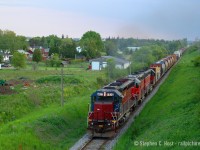 This is an era of GEXR that was not often photographed, as they ran at night. Also, I wasn't a huge fan of the motive power, but I was able to get a couple photos here and there. Outside of locals, photos of 432/1 from the darkness era 2008 to what, 2012? are hard to come by due to the night ops, also an eastbound at dinner was photography hell as you'd be shooting into the sun. Imagine my surprise when I found this in my archives, it's not that half bad! Around the time of G&W Takeover 432/1 returned to daylight and ran in perfect timeslots for photography, and still does.<br><br>This photo was taken at 8:31 PM from Jones Baseline Rd. At least we have the right leader, Built in 1968 as DRGW 5334 as a SD45, rebuilt as an EMD SD40M-3, HLCX 6522, 3821 and 4019 on 432 just outside of the City of Guelph.<br><br>Photo notes: Nikon D70, 50mm fixed lens at f/2.5 to keep the shutter speed fast in rapidly failing light.