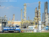 At Nova's Corunna site, two switchers sit idle as the day has ended. The first far in the background is NCLX 2003, a MPI MP1500D and fairly new (last 10 years?). The one up front, it probably has a number but I can't see it in this picture is an older SW of some kind. Each Nova plant has two to three switchers, for a total of about six top eight in the area, but only one plant is shootable (today) from public property. This is along HWY 40 toward Chatham. Note that NOVA plans  a $2 Billion expansion adjacent to this site, and at the Moore site (construction is underway) with planned rail yard and track expansions. See <a href=http://www.novachem.com/ExWeb%20Documents/sarnia-lambton/MEGrowthFactSheet_Dec2017.pdf target=_blank>here</a> for more if interested.