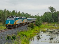 60 kilometres south of their station stop at Sudbury Junction, VIA Rail's flagship train, “The Canadian” is seen racing across the muskeg of Northern Ontario at mile 96.4 of the Canadian Pacific Parry Sound Subdivision. For roughly 130 kilometres, CP’s mainline more or less parallels the Trans-Canada Highway, making for an exciting chase through the beautiful and rugged Shield country. The Canadian, of course, was a fantastic subject to follow on my travels North. 