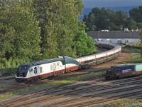 Amtrak Cascades train 517, the 6:35am departure from Vancouver BC's Pacific Central station is leaving station track.  Its locomotives and Talgo coach-set closely match another Cascades train that derailed at a curve near DuPont in Washington state on 18 December 2017, part of that train falling onto I-5.<br><br> 
In the lead today is Siemens SC-44 "Charger" diesel electric locomotive AMTK 1400 with Washington State DOT (WSDOT) and Oregon DOT lettering, and the Mt. Hood Talgo trainset in the Cascades paint scheme.  A GE P42DC "Genesis" AMTK 85 in ordinary Amtrak scheme is at the rear (it lead into Vancouver).  Note the short articulated sections and single axle wheelsets of the passively-tilting Talgo coach-set. The end transition sections with HEP and baggage compartment were styled to merge with F59PHi locomotives originally purchased for Cascades service.<br><br>
The accident train was lead by AMTK 1402 (scrapped), with the Mount Adams Talgo coach-set (scrapped), and trailing AMTK 181  (stayed on rails, back in service).  The 18 Dec 2017 mishap occurred on the inaugural revenue run over the recently upgraded Point Defiance bypass.  The final NTSB report is pending, but entering a 30 mph limit curve at 78 mph is always a bad idea. There were 3 fatalaties and numerous injuries, from minor to very serious, and at least $40 million in property damage.  I was told that Talgo trainsets were removed from Cascades service after the accident, until cleared of blame. 
