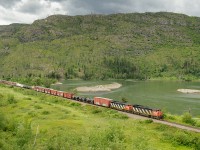 CN C40-8Ms 2417 and 2425 lead a short 58 car Vancouver-Prince George train M354 along the shores of the North Thompson River between Exlou and Barriere on CN's Clearwater Sub.