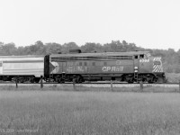 FP7A CP 4066 in the narrow-stripes CP Rail paint scheme hauls the Sudbury-Toronto section of "The Canadian" south of Major Mackenzie Drive during summer in the mid 1970's. A single 4000 series FP7A was the most typical power for this train at the time. <br><br>
Perhaps the most interesting thing about CP 4066 is its ultimate fate. Passed on to VIA, repainted and renumbered to VIA 6566, it was the lead unit of the combined Super Continental + Skeena eastbound out of Jasper on February 8, 1986. Through no fault of its passenger train crew, it was among the equipment destroyed in a terrible head-on collision with a CN freight train near Hinton Alberta. There were 23 fatalities, including the head-end crews of both trains.