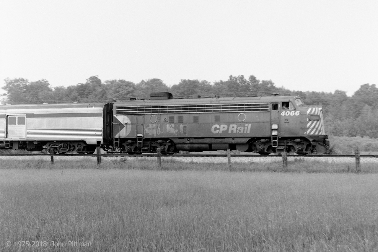 FP7A CP 4066 in the narrow-stripes CP Rail paint scheme hauls the Sudbury-Toronto section of "The Canadian" south of Major Mackenzie Drive during summer in the mid 1970's. A single 4000 series FP7A was the most typical power for this train at the time. 
Perhaps the most interesting thing about CP 4066 is its ultimate fate. Passed on to VIA, repainted and renumbered to VIA 6566, it was the lead unit of the combined Super Continental + Skeena eastbound out of Jasper on February 8, 1986. Through no fault of its passenger train crew, it was among the equipment destroyed in a terrible head-on collision with a CN freight train near Hinton Alberta. There were 23 fatalities, including the head-end crews of both trains.