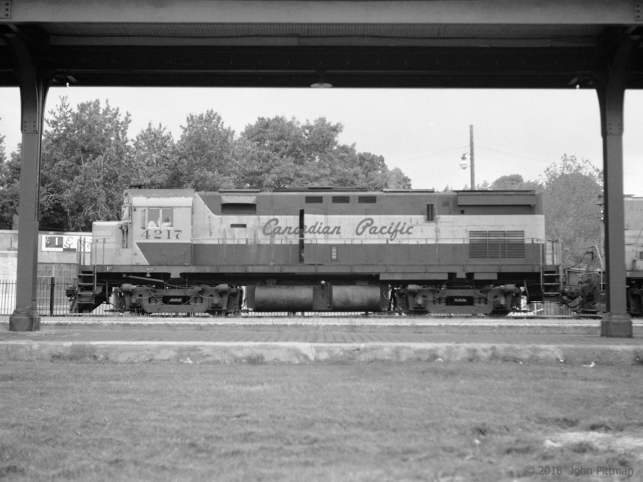 Framed by the platform canopy, MLW C424 CP 4217 leads the afternoon freight from Trois-Rivieres to Montreal with a CP RS-18 next. The maroon and grey paint looks very clean; CP 4217 was then 5 years old.